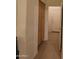 Hallway with wooden storage cabinet leads to door, tile flooring at 14214 N Galatea Dr # A, Fountain Hills, AZ 85268