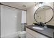 Bright bathroom with tub, dark stone countertop, and modern fixtures at 154 W 5Th St # 246, Tempe, AZ 85281