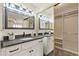 Bathroom featuring double sinks, modern lighting, and a mirrored closet at 154 W 5Th St # 246, Tempe, AZ 85281