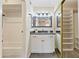 Bright bathroom featuring a vanity with framed mirror, tub, and walk-in closet at 154 W 5Th St # 246, Tempe, AZ 85281