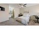 Comfortable bedroom with a ceiling fan, dresser, and an ensuite bathroom with dual sinks at 154 W 5Th St # 246, Tempe, AZ 85281