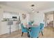 Inviting dining area with a modern pendant light, adjacent to the kitchen with bar stool seating at 154 W 5Th St # 246, Tempe, AZ 85281