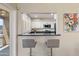 Modern kitchen featuring a breakfast bar and stainless steel appliances at 154 W 5Th St # 246, Tempe, AZ 85281