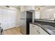 Kitchen showcasing stainless steel refrigerator and modern countertops, ample cabinet storage at 154 W 5Th St # 246, Tempe, AZ 85281