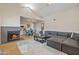 Open-concept living space with fireplace, dining area, modern lighting, and view into the kitchen at 154 W 5Th St # 246, Tempe, AZ 85281