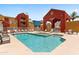 Community pool and spa area with multiple lounge chairs and colorful buildings in the background at 154 W 5Th St # 246, Tempe, AZ 85281