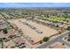 Expansive aerial view of single-Gathering homes with RV parking in a suburban community at 1564 E Leaf Rd, San Tan Valley, AZ 85140
