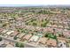 Expansive aerial view of single-Gathering homes featuring pools and well-maintained landscaping in a suburban community at 1564 E Leaf Rd, San Tan Valley, AZ 85140