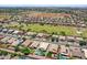 Expansive aerial view of single-Gathering homes featuring pools and well-maintained landscaping in a suburban community at 1564 E Leaf Rd, San Tan Valley, AZ 85140