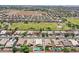 Expansive aerial view of single-Gathering homes featuring pools and well-maintained landscaping in a suburban community at 1564 E Leaf Rd, San Tan Valley, AZ 85140