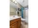 Well-maintained bathroom featuring a vanity with sink, toilet, and shower/tub combination with a shower curtain at 1564 E Leaf Rd, San Tan Valley, AZ 85140