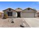 Charming single-story home with a two-car garage, desert landscaping, and neutral stucco facade at 1564 E Leaf Rd, San Tan Valley, AZ 85140