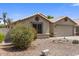 Charming single-story home featuring low-maintenance desert landscaping and a neutral color palette at 1564 E Leaf Rd, San Tan Valley, AZ 85140