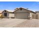 Beige single Gathering home with a two car garage, desert landscaping, and a sunny blue sky at 1564 E Leaf Rd, San Tan Valley, AZ 85140