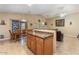 Open concept kitchen with a breakfast bar, stainless steel appliances, and easy access to the dining area at 1564 E Leaf Rd, San Tan Valley, AZ 85140