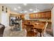 Spacious kitchen with ample counter space, stainless steel appliances, and an open layout to the dining area at 1564 E Leaf Rd, San Tan Valley, AZ 85140