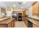 Well-appointed kitchen featuring stainless steel appliances, ample cabinet space, and a functional layout at 1564 E Leaf Rd, San Tan Valley, AZ 85140