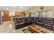 Inviting living room with ample seating, warm lighting, and a view into the adjacent dining area at 1564 E Leaf Rd, San Tan Valley, AZ 85140