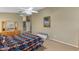 Another view of the main bedroom featuring a ceiling fan, and ample space for relaxation at 1564 E Leaf Rd, San Tan Valley, AZ 85140