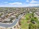 Aerial view of the community highlighting the home's location near a park and green space at 16586 W Latham St, Goodyear, AZ 85338