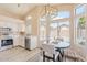 Bright kitchen with stainless steel appliances, white cabinets, and an adjacent breakfast nook at 16586 W Latham St, Goodyear, AZ 85338