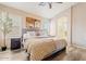Serene bedroom with wood floors, neutral palette, and a luxurious comfortable bed at 16586 W Latham St, Goodyear, AZ 85338