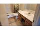 Bathroom featuring a shower-tub combo, a toilet, and vanity with sink at 17458 N 64Th Dr, Glendale, AZ 85308