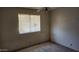Bedroom with a window and ceiling fan at 17458 N 64Th Dr, Glendale, AZ 85308