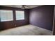 Bedroom with two windows and purple paint at 17458 N 64Th Dr, Glendale, AZ 85308