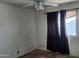 Bedroom featuring a window with curtains and ceiling fan at 17458 N 64Th Dr, Glendale, AZ 85308