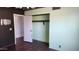 Bedroom featuring laminate flooring and a walk-in closet at 17458 N 64Th Dr, Glendale, AZ 85308