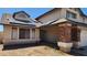 Charming home featuring solar panels, brick columns, and a covered porch at 17458 N 64Th Dr, Glendale, AZ 85308