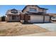 Two-story home with solar panels and a three-car garage enhancing curb appeal at 17458 N 64Th Dr, Glendale, AZ 85308