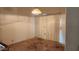 A living room with vertical blinds, carpet and a chandelier at 17458 N 64Th Dr, Glendale, AZ 85308