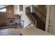 A view of the stairs and fireplace from the kitchen at 17458 N 64Th Dr, Glendale, AZ 85308