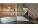 A view of the living room showing the upper landing and staircase at 17458 N 64Th Dr, Glendale, AZ 85308