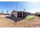 Spacious backyard with gravel landscaping, partial lawn, sprinkler system and fenced perimeter at 1747 W Devon --, Mesa, AZ 85201