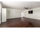 Spacious basement area with wood floors, white brick walls and natural light at 1747 W Devon --, Mesa, AZ 85201
