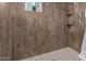 Renovated bathroom with a standup shower, white trim, and dark faux-wood tiling at 1747 W Devon --, Mesa, AZ 85201