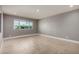 Bright room featuring neutral paint, tile floors, base trim and large windows at 1747 W Devon --, Mesa, AZ 85201
