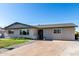 Charming single-story home with a well-maintained front yard and a long driveway at 1747 W Devon --, Mesa, AZ 85201