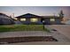 Charming single-story home featuring a well-manicured lawn and a paved walkway at 1747 W Devon --, Mesa, AZ 85201