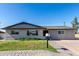 Traditional single-story house boasting great curb appeal with healthy green lawn at 1747 W Devon --, Mesa, AZ 85201