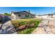 Charming home with a well-maintained front yard and brick walkway at 1747 W Devon --, Mesa, AZ 85201