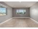 Spacious living room with tile floors, recessed lighting, and large windows offering natural light at 1747 W Devon --, Mesa, AZ 85201
