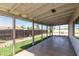 A screened-in porch with a ceiling, concrete floor and a view of the backyard at 1747 W Devon --, Mesa, AZ 85201
