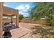 Spacious backyard featuring a covered patio, block wall, and a barbecue at 1753 N St Francis Pl, Casa Grande, AZ 85122