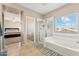 Beautiful bathroom featuring tile floors, a tub, a shower and access to the primary bedroom at 1753 N St Francis Pl, Casa Grande, AZ 85122