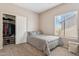 Bedroom featuring carpeted floors, closet and a window offering natural light at 1753 N St Francis Pl, Casa Grande, AZ 85122