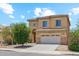 Charming two-story home with a tile roof, attached two-car garage, and desert landscaping at 1753 N St Francis Pl, Casa Grande, AZ 85122